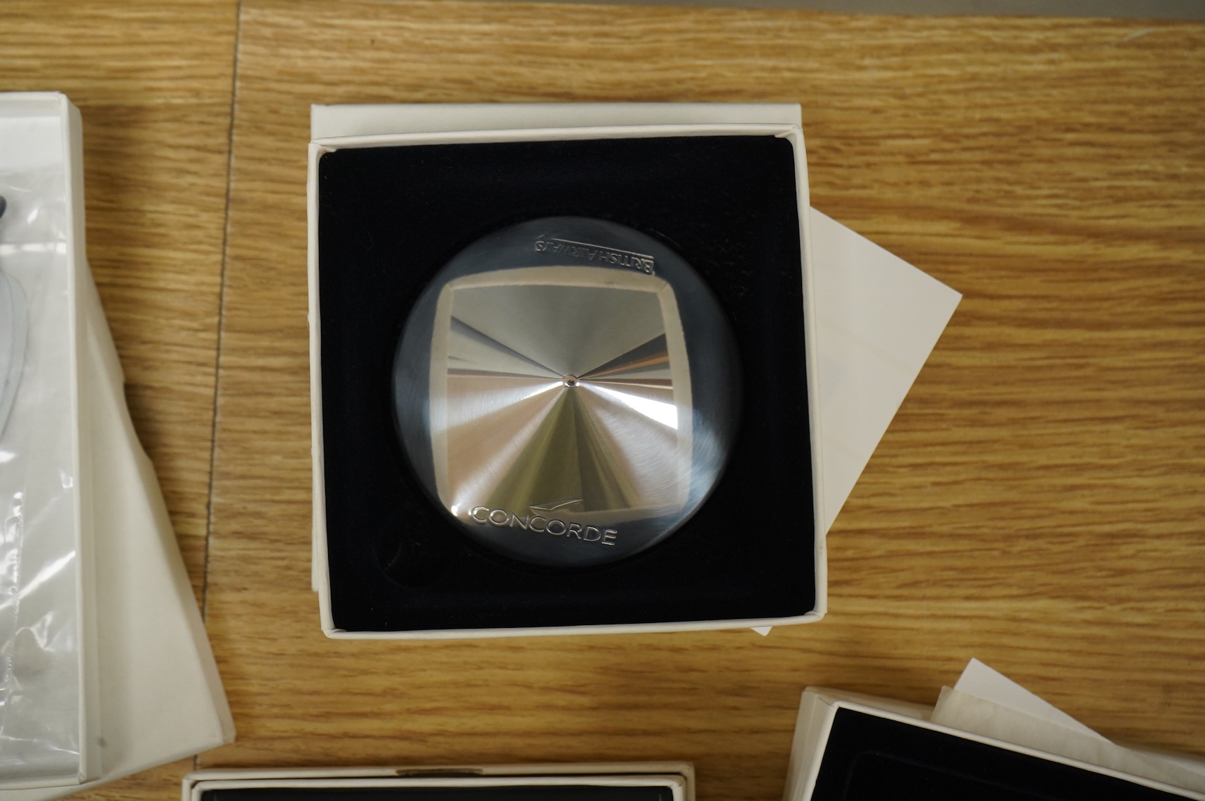 Five boxed British Airways Concorde branded promotional items including; a sterling silver trinket box by Links of London, a hip flask, a bottle opener, a leather credit card holder, and three unused luggage labels